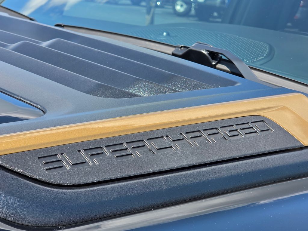 Supercharged Whipple HEMI gold hood accent badge on the 2026 Ram 1500 DC650